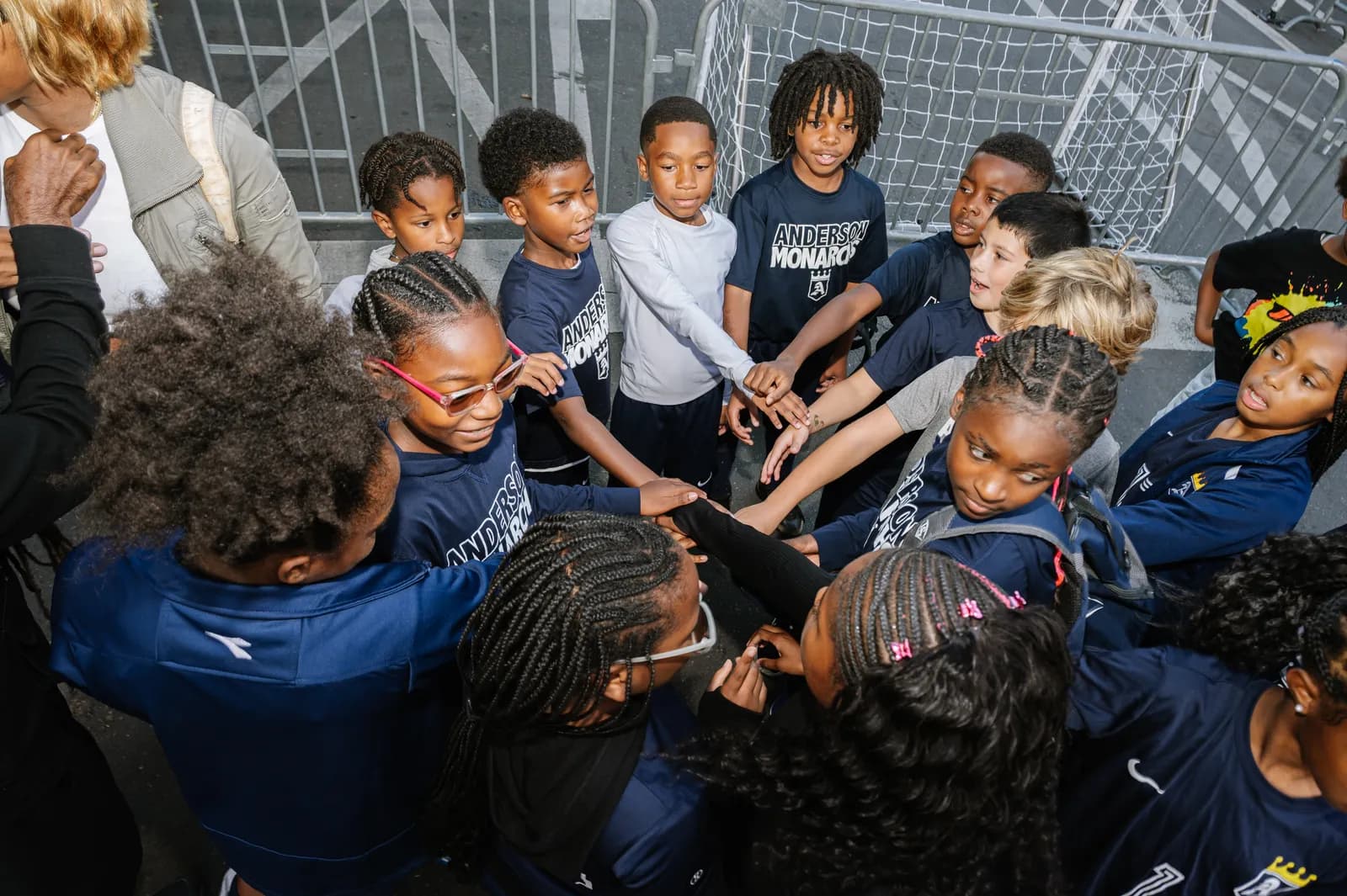 Team huddle at an ODUNDE Sports event