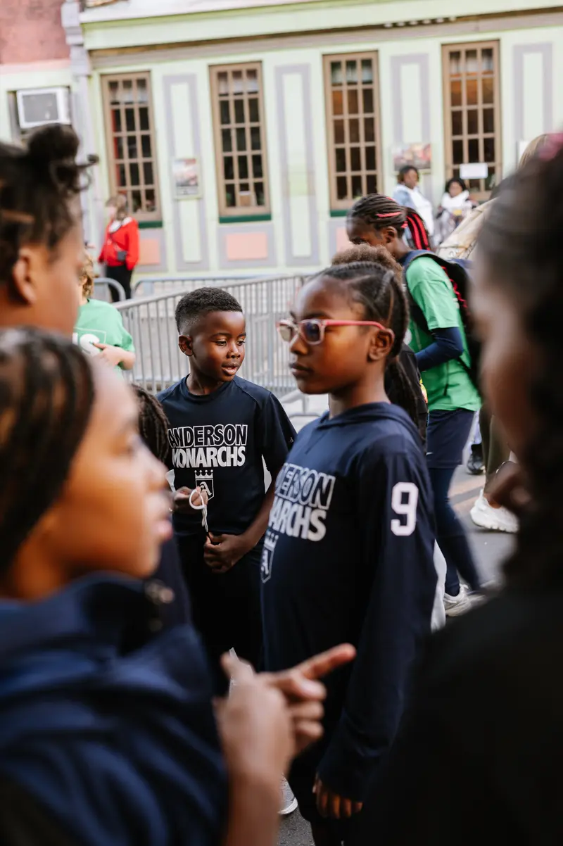 Youth athletes in Anderson Monarchs jerseys gathered outdoors before a match